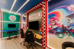 Enter a lively gaming paradise adorned with colorful murals of iconic characters. With comfortable gaming chairs and a dedicated setup, this room is the ultimate backdrop for hours of stylish fun and excitement.