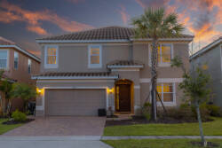 Welcome to this charming home, where a lush entrance and a beautifully paved driveway greet you. As the sunset casts warm hues on the elegant architecture, you’ll feel invited to step inside and enjoy your stay.