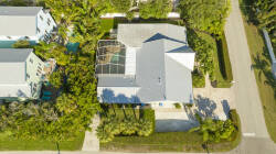 Experience the charm of this lovely home surrounded by lush greenery and palm trees. The inviting pool and spacious deck are ideal for sun-soaked afternoons, while the beautiful landscaping offers a serene retreat for relaxation.