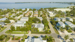 Discover a peaceful neighborhood nestled among lush greenery and charming homes, just moments from sparkling waters. Its welcoming layout and beautiful streets offer a delightful escape in a stunning, picturesque setting.