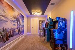 Enjoy a Star Wars themed arcade area with classic game machines, colorful LED lighting, a bold wall mural, and fun galaxy-inspired details for extra entertainment.