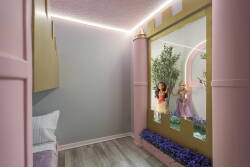 Step into a whimsical nook, where playful pink accents and soft lighting create a delightful atmosphere. The charming wall decor features enchanting figures, while a cozy bed invites relaxation and imaginative adventures.