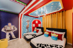 Step into a vibrant haven where playful decor brings joy to every corner. The bold colors and whimsical wall art featuring beloved characters create a fun atmosphere, while cozy bedding invites restful nights after exciting days.