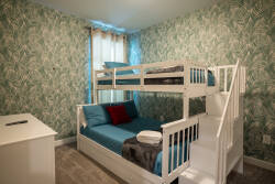 This bright and cheerful bedroom features a stylish bunk bed with plush blue bedding and playful tropical wallpaper. Natural light fills the space, creating a cozy nook ideal for rest and relaxation after your adventures.