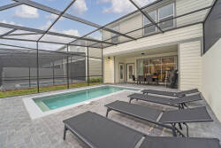 Step outside to your private oasis featuring a sleek plunge pool and modern lounge chairs perfect for sunbathing. Relax in the tranquil atmosphere of clean lines and soft gray tones, all while enjoying your privacy.