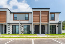 Step into contemporary comfort with this stylish facade featuring sleek, modern lines and warm wood accents. Large windows provide abundant natural light, creating an uplifting atmosphere as you arrive at your home away from home.
