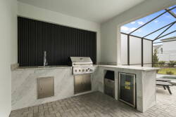 Experience our chic outdoor kitchen featuring elegant marble countertops and a modern grill, ideal for cooking lovers. Its open layout fills with natural light, making it the perfect place for entertaining friends or enjoying.