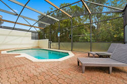Enjoy the sunshine by the private pool, nestled in a peaceful setting that harmonizes nature and comfort. The warm terracotta pavers and inviting lounge chairs create the perfect spot to relax and soak in the serene atmosphere.