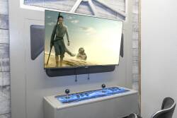 Enjoy a unique entertainment experience with a sleek wall-mounted TV and a striking blue console, ideal for gaming or movie nights. Its contemporary design adds a stylish touch, making your leisure time both fun and enjoyable.