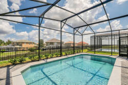 Step into your private oasis with this sparkling pool, framed by a stylish screen enclosure that offers both comfort and security. Enjoy sunny days while lounging on the deck, surrounded by lush greenery and a tranquil atmosphere.