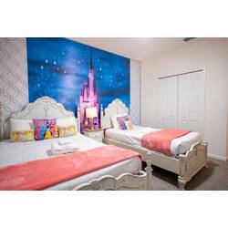 Rest in a dreamy princess-themed bedroom with two cozy beds, elegant white headboards, soft pink accents, and a magical castle mural under a starry sky. Playful pillows and gentle lighting create a sweet space for vacation.