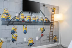 Bright and playful, this room features a vibrant Minions mural that adds fun to your stay. The sleek decor, cozy floor lamp, and mounted TV invite you to relax after a day of adventure. Enjoy a memorable experience here!