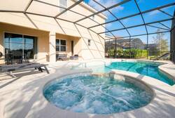 Experience serenity in our private spa, nestled in a spacious screened enclosure. Relax in calming waters as sunlight brightens the cozy seating area, creating the perfect atmosphere for delightful, leisurely afternoons.