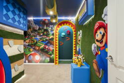 Immerse yourself in a lively gaming paradise filled with whimsical murals and playful textures. The vibrant colors and engaging decor set the stage for fun adventures, perfect for kids and the young at heart alike.