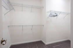 This spacious closet provides plenty of shelving and hanging space to help you organize your belongings during your stay. Its neutral tones and clean lines create a refreshing atmosphere for a truly effortless vacation.