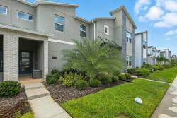 Experience a charming exterior with lush greenery and vibrant landscaping that welcomes you. The contemporary design blends stylish siding and stone accents, while dual-level architecture ensures a spacious, light-filled stay.
