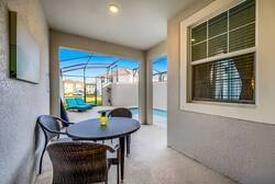 Step outside to your private oasis, where a cozy table awaits for your morning coffee or evening cocktails. The screened patio offers a breezy vibe, and the earthy tones deepen your connection to nature just beyond.