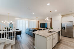 Experience a stylish living area with a spacious layout and large windows that invite natural light. The contemporary kitchen, with its sleek marble countertop and modern appliances, is ideal for enjoying meals together.