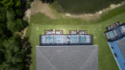 Bask in the sun from your private outdoor lounge, where spacious seating and a clear view of the tranquil pond create an ideal spot for relaxation. The lush green lawn invites leisurely strolls or gatherings with loved ones.
