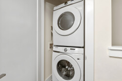 Experience the convenience of in-unit laundry with this sleek, stackable washer and dryer. The crisp white finish blends seamlessly into the modern decor, ensuring you feel at home while keeping your essentials fresh and clean.