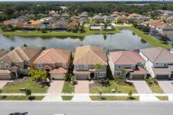 Discover the charm of this vibrant neighborhood, where beautiful homes and lush greenery create a serene atmosphere. Enjoy picturesque views of the tranquil pond, perfect for relaxation and exploration just steps from your door.
