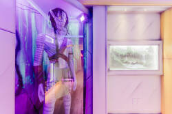 Experience a world of creativity with captivating decor that showcases a striking figure in vibrant colors alongside a peaceful nature scene. The unique lighting adds to the atmosphere, ensuring your visit is truly unforgettable.