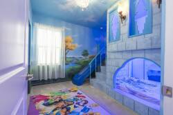 Enter a whimsical world with vibrant murals, playful decor, and a colorful rug. The soft glow of the chandelier adds to the enchanting atmosphere, making it a perfect space for your imaginative escapes.