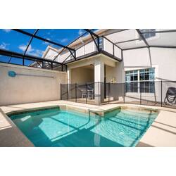 Welcome to your private oasis featuring a sparkling pool and a sleek screened enclosure for ultimate comfort. Enjoy the bright, airy layout with large windows, ideal for relaxing on the patio and unwinding in the inviting waters.
