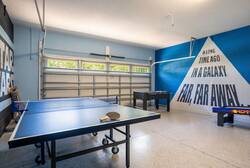 Experience our lively game room, adorned with a bold blue mural that inspires fun. Enjoy friendly competitions on the quality ping pong table, all in a bright, spacious area filled with natural light, ideal for guests of all ages.