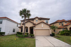 Welcome to this charming vacation home, where Mediterranean style meets modern comfort. Enjoy the warm stucco exterior and rich tile roof as you explore the lush landscaping that offers a perfect spot for a leisurely stroll.