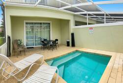 Discover your private oasis with a refreshing pool, warm wooden decking, and a cozy seating area. Large sliding doors let in natural light and offer easy outdoor access, creating the perfect setting for relaxed gatherings.