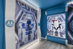 Immerse yourself in a vibrant, themed room that takes you to a galaxy far away, with stunning murals of iconic characters on a bold blue backdrop. The sleek, modern design is ideal for relaxation and playful adventures.